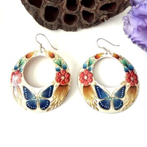 aretes cobre redondos con mariposa azul